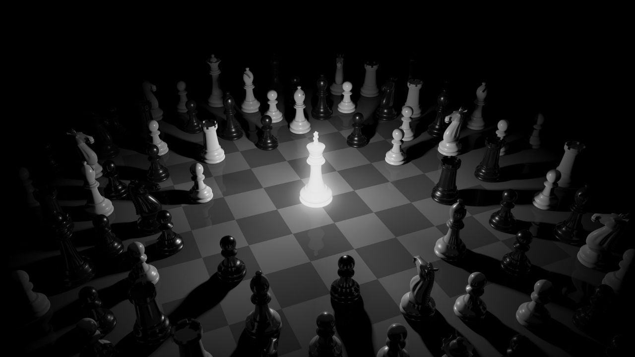 A chess game with a leader glowing in bright white light